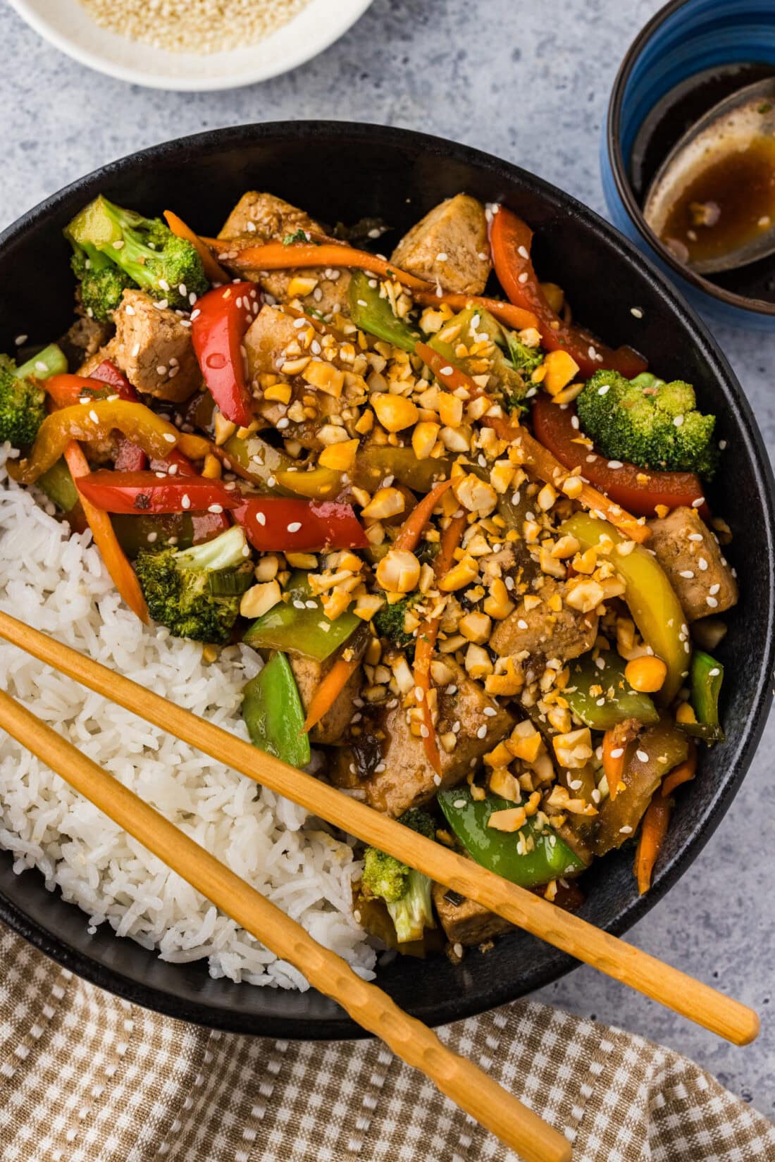 Close up photo of a bowl of Tofu Stir Fry with white rice
