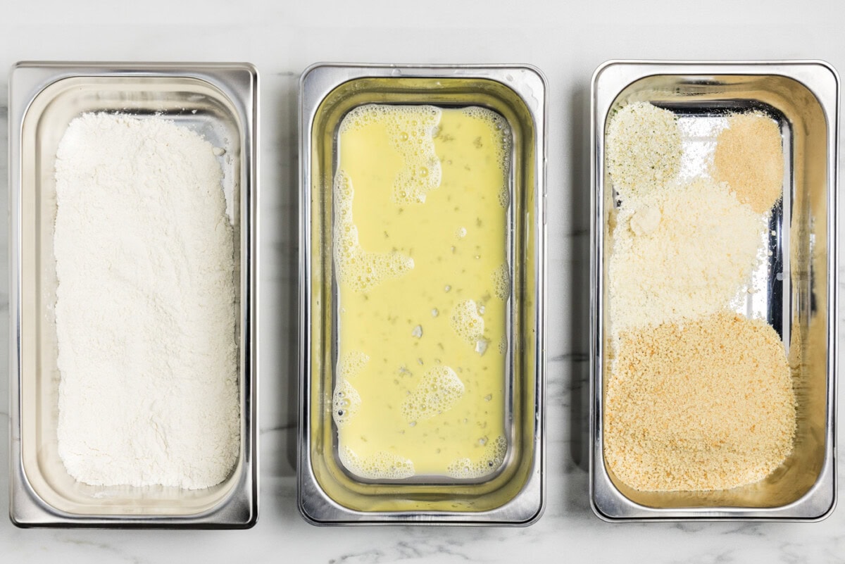 breading trays with flour in one, egg in the next, and panko bread crumb mixture in the third.