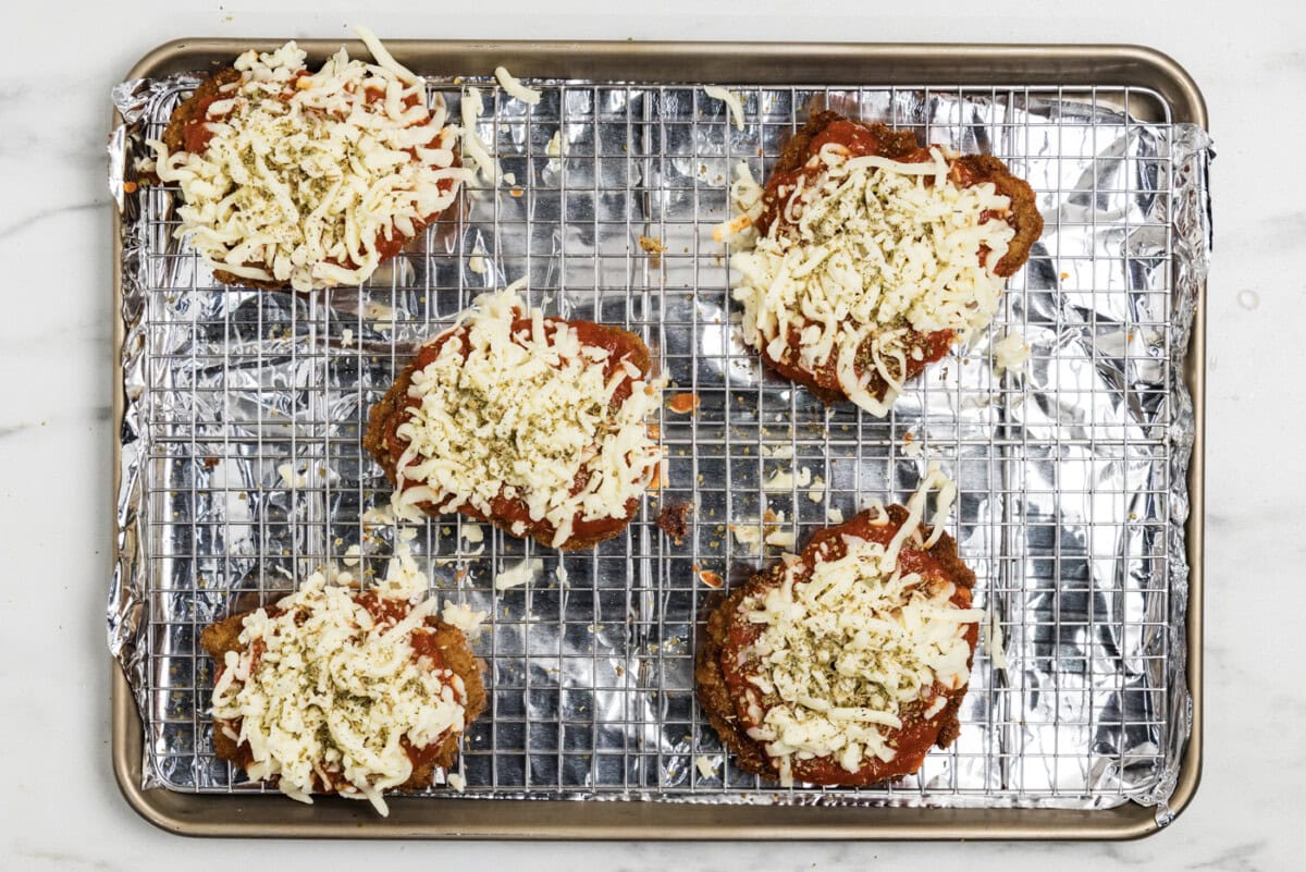 mozzarella cheese on top of marinara fried veal cutlets