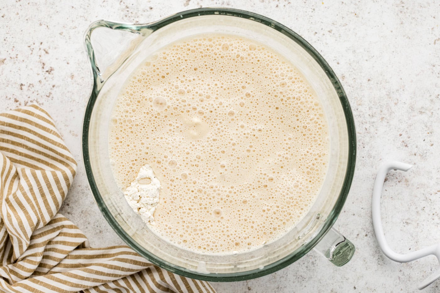 dry ingredients, wet ingredients, and sponge in a stand mixer bowl