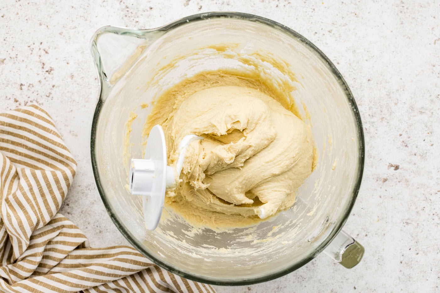 breakfast danish dough in a stand mixer bowl with hook attachment