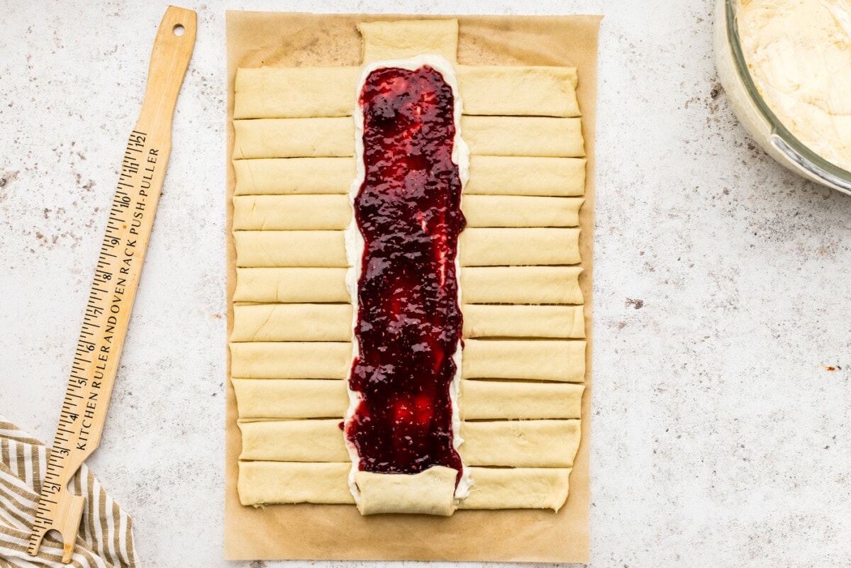 strips cut out on sides of dough along the filling lines