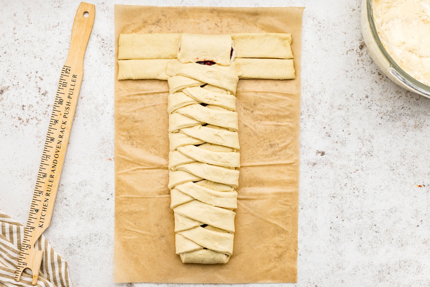 folding the end tab of the sectioned dough over the filling