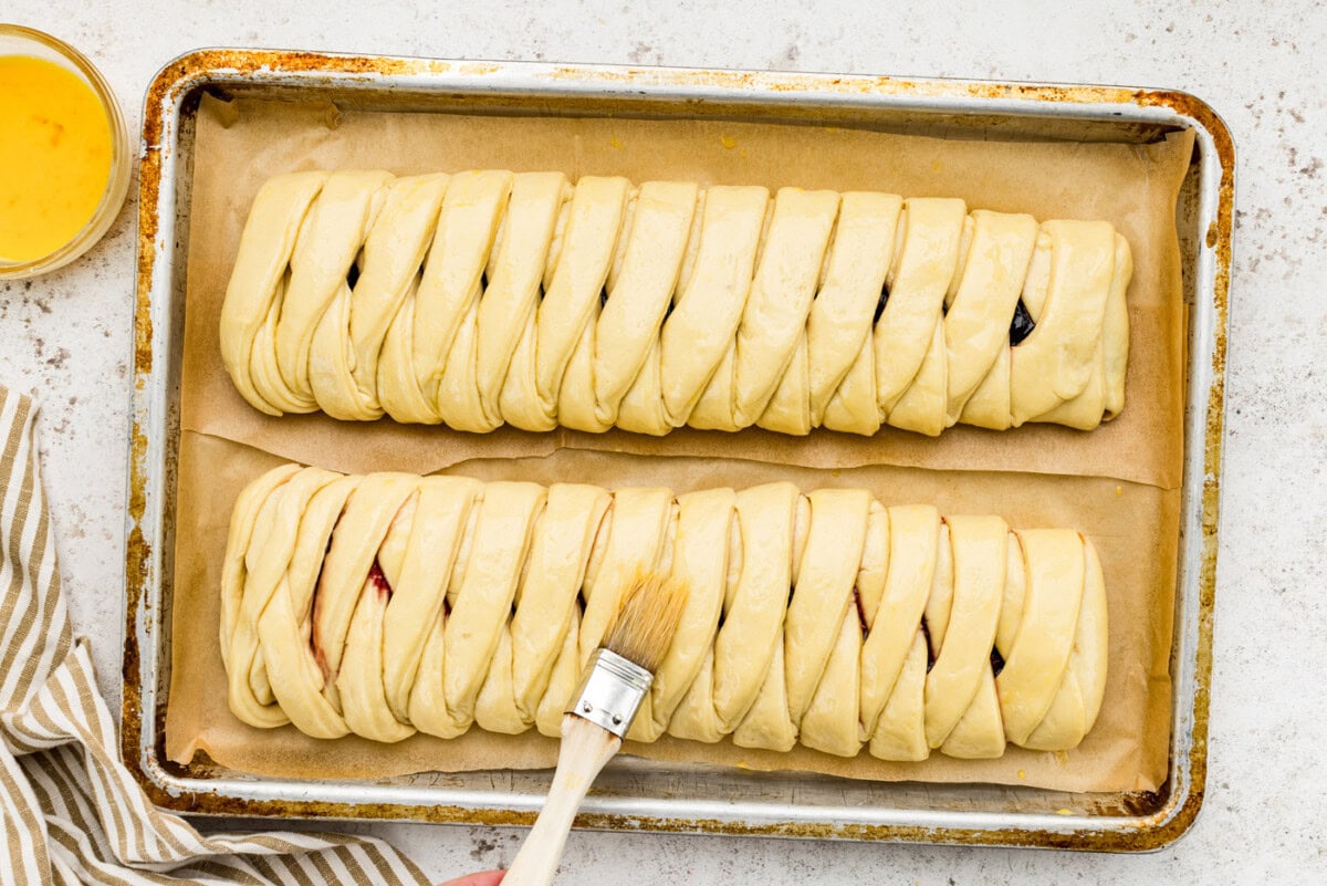 brushing danish dough with egg wash