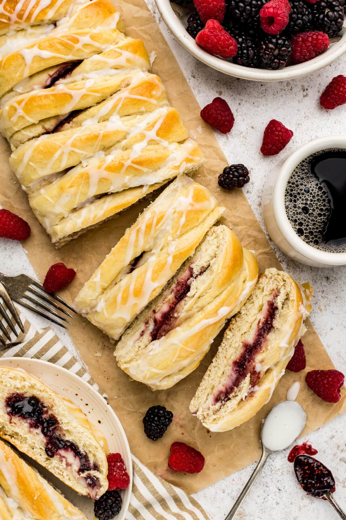 Braided Breakfast Danish cut into slices on parchment paper
