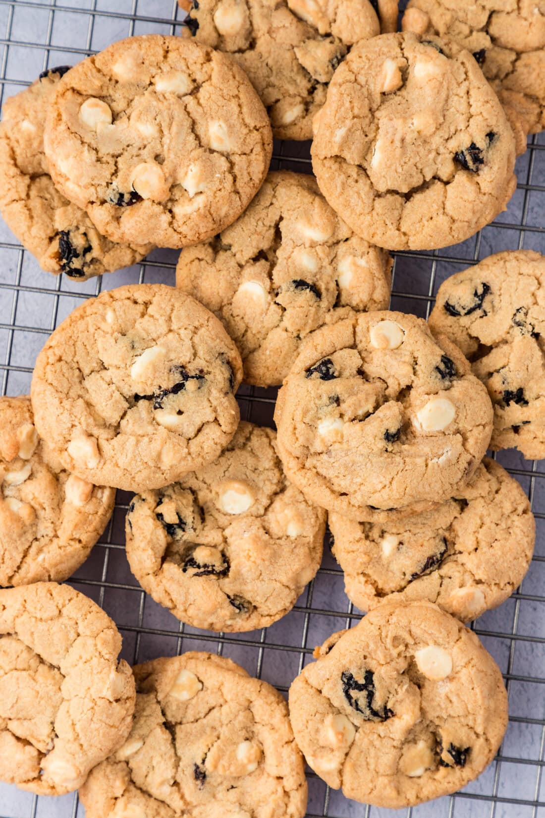 Pile of Cherry White Chocolate Chip Cookies on a wire rack