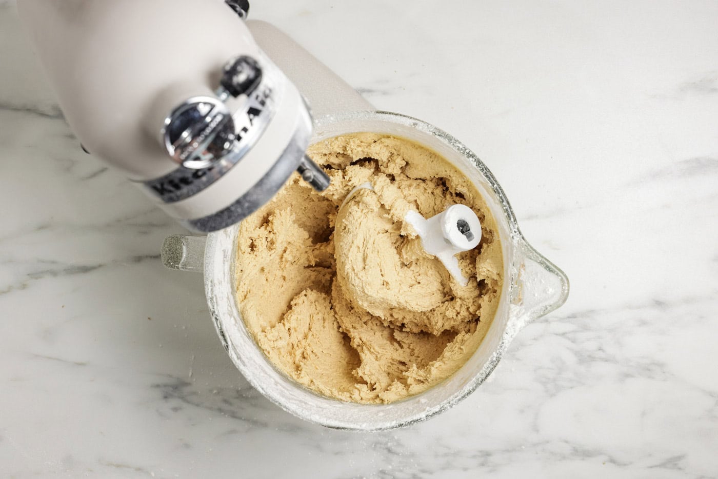 cookie dough in stand mixer bowl with the paddle attachment