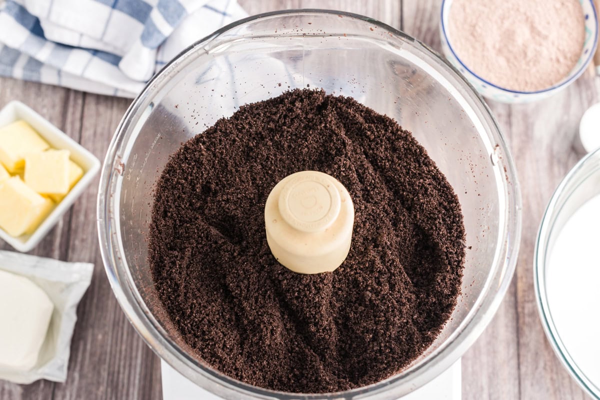 Oreo cookie crumbs in a food processor
