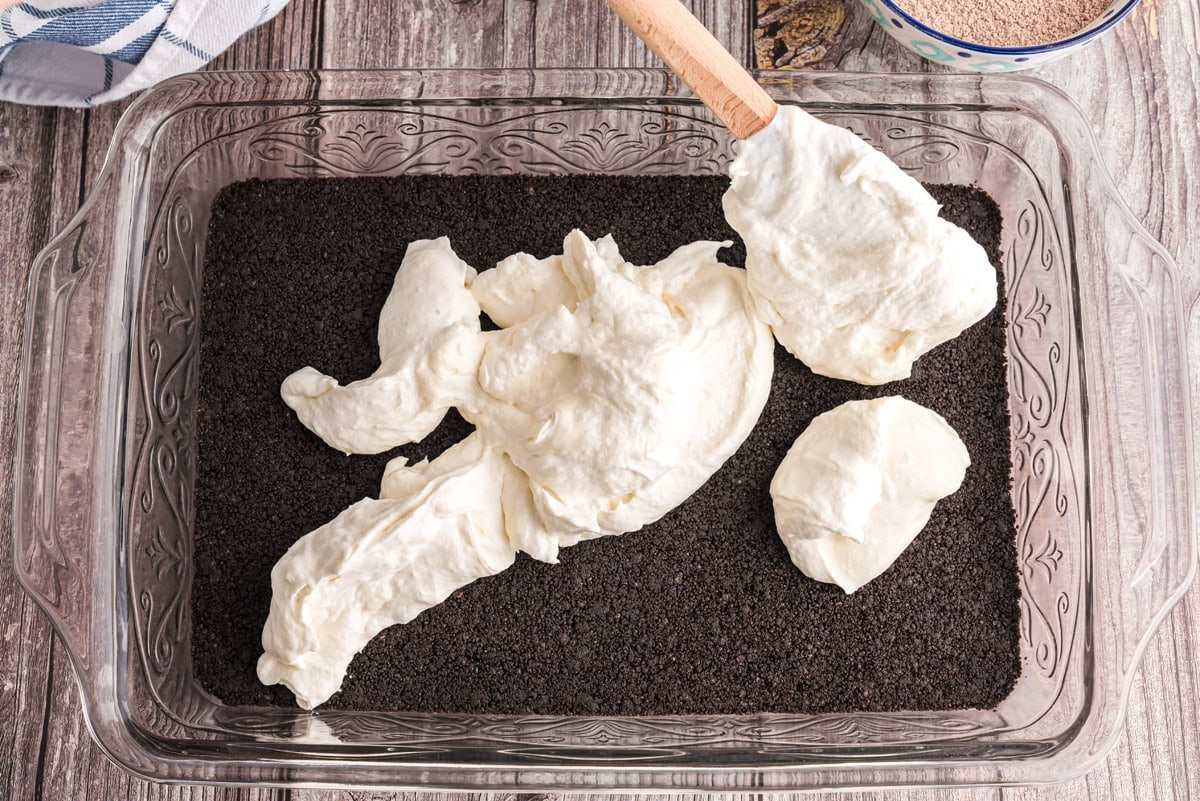 Cream cheese mixture spooned on top of the cookie crumb mixture
