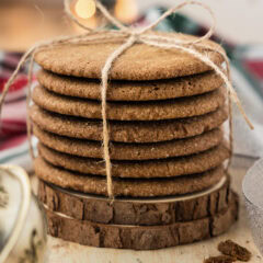 Close up photo of a stack of Crispy Gingersnap Cookies wrapped in twine