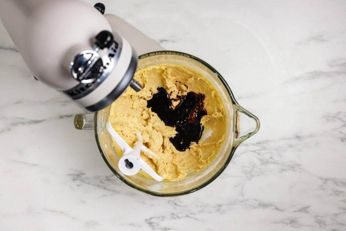 dark molasses added to mixer bowl with egg, butter, and sugars