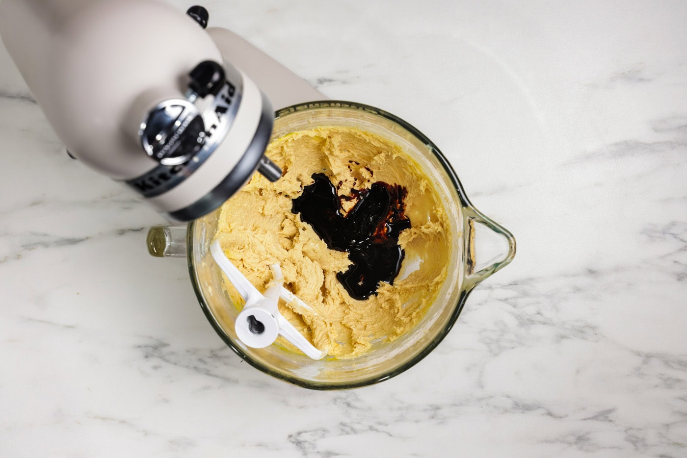 dark molasses added to mixer bowl with egg, butter, and sugars