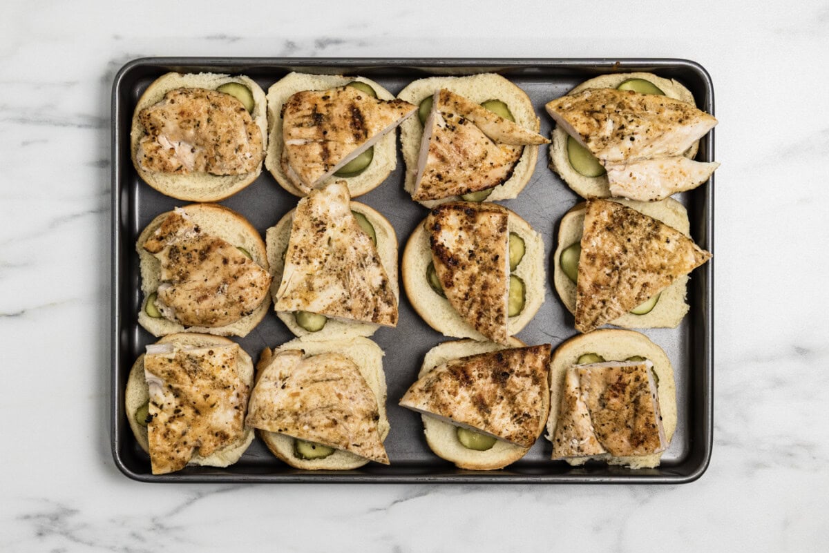 cooked chicken on top of sliders buns