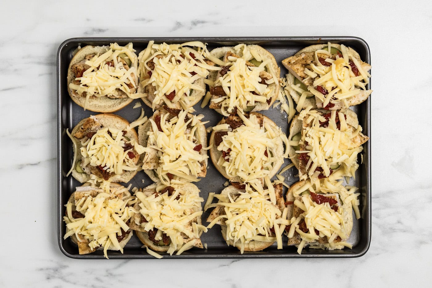 shredded gouda cheese over top chicken sliders