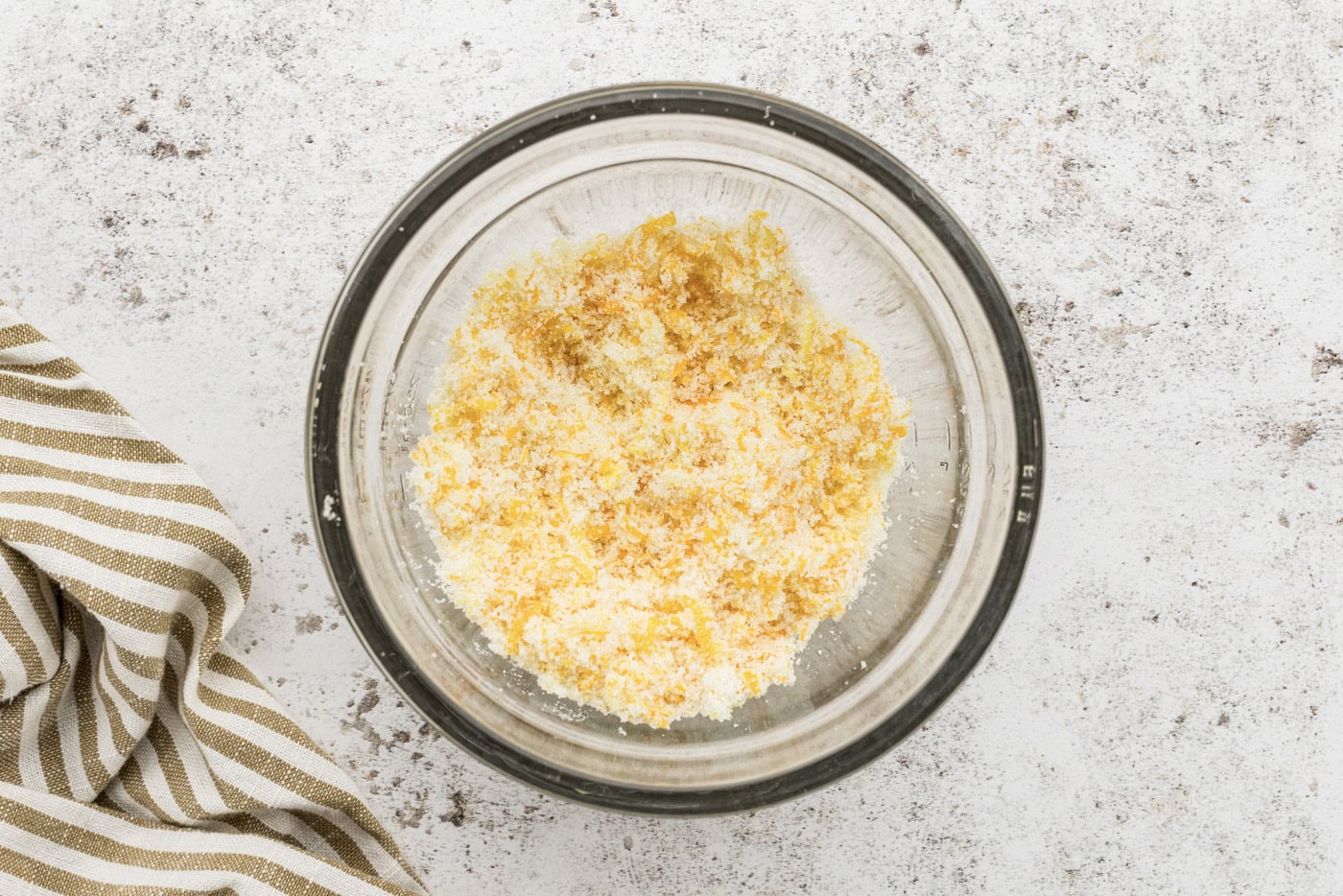 orange zest and sugar mixed in a bowl