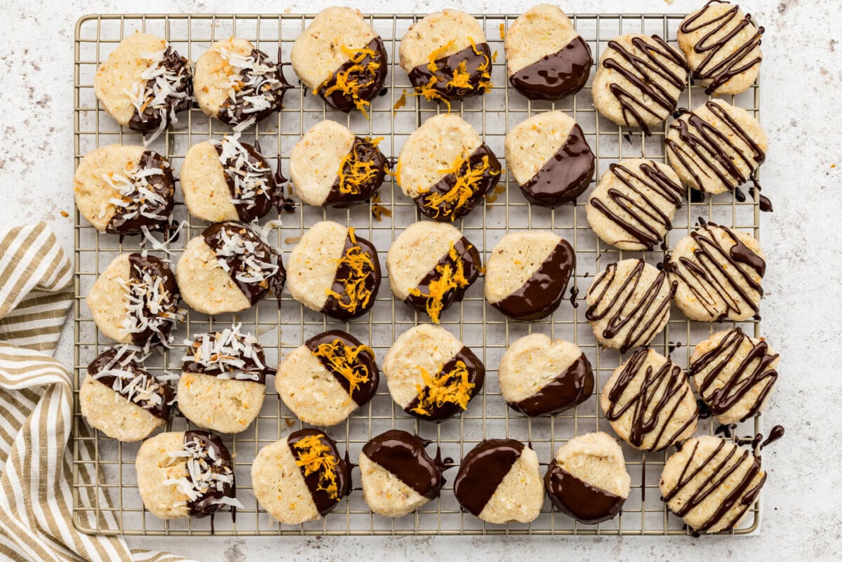 overhead photo of decorated icebox cookies on a wire cooling rack