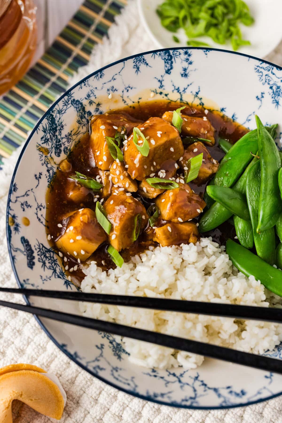 Instant Pot Honey Garlic Chicken in a bowl with rice and peas