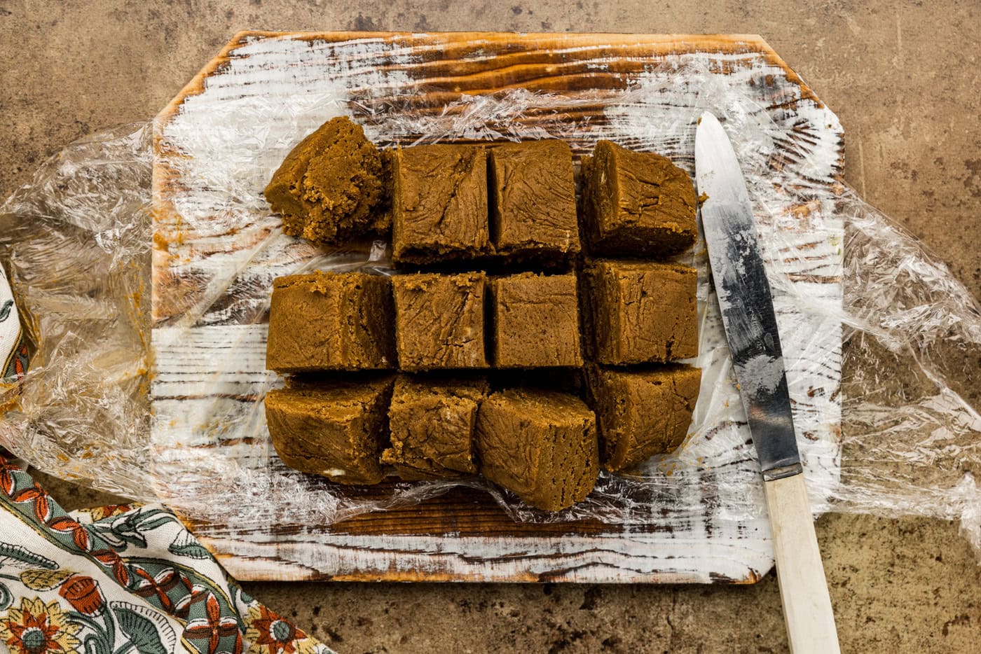 molasses cookie dough sliced into 12 squares