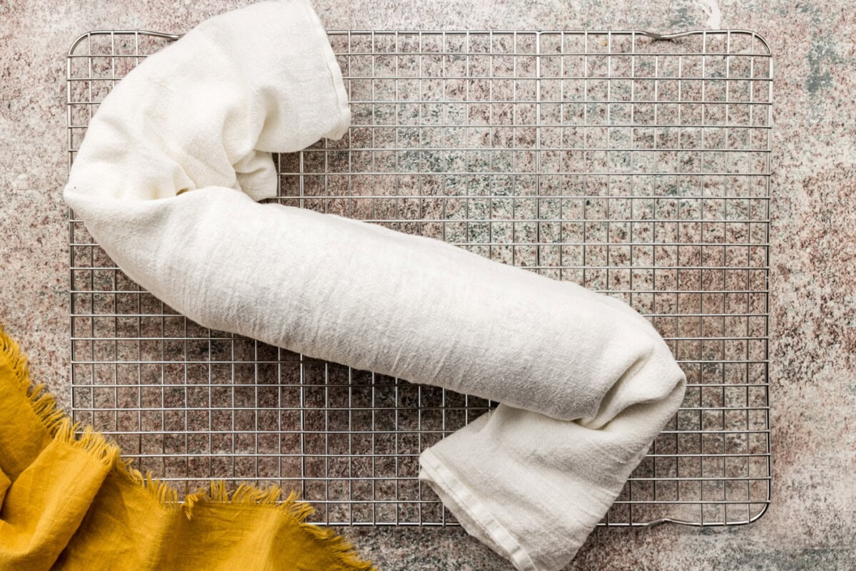 pumpkin cake roll rolled in a kitchen towel