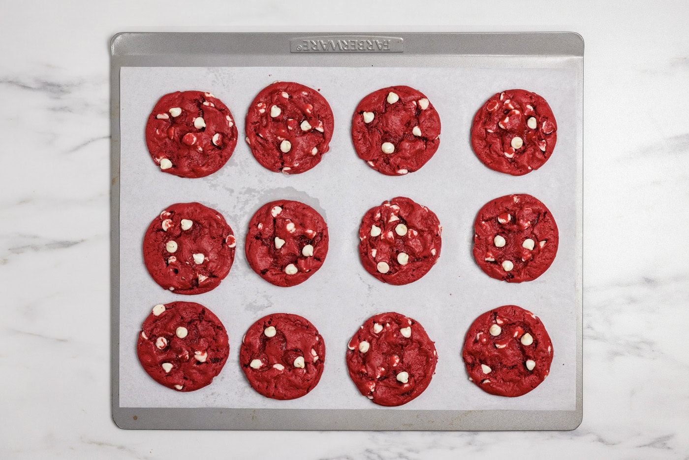 red velvet cookies on a baking sheet