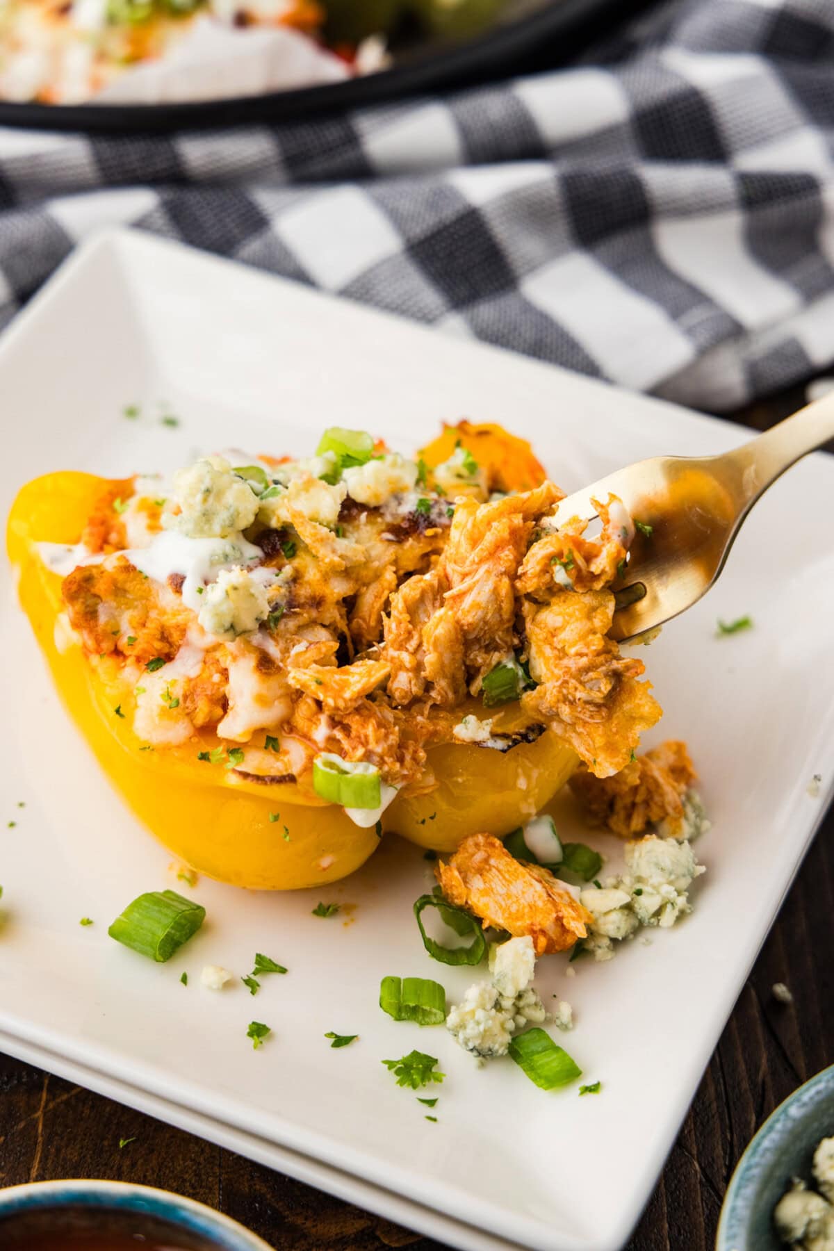 Fork picking up a piece of Buffalo Chicken Stuffed Pepper