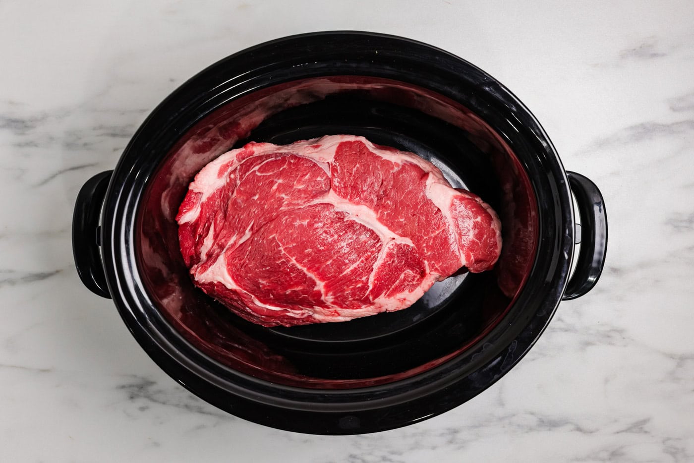 Thawed chuck roast in a crockpot