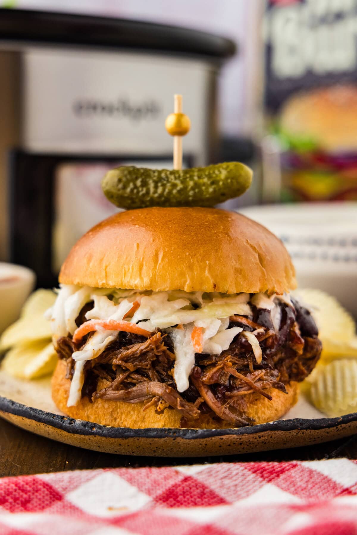 Crockpot BBQ Beef Sandwiches plated with potato chips