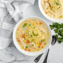 Close up photo of two bowls of Crockpot Chicken and Dumplings