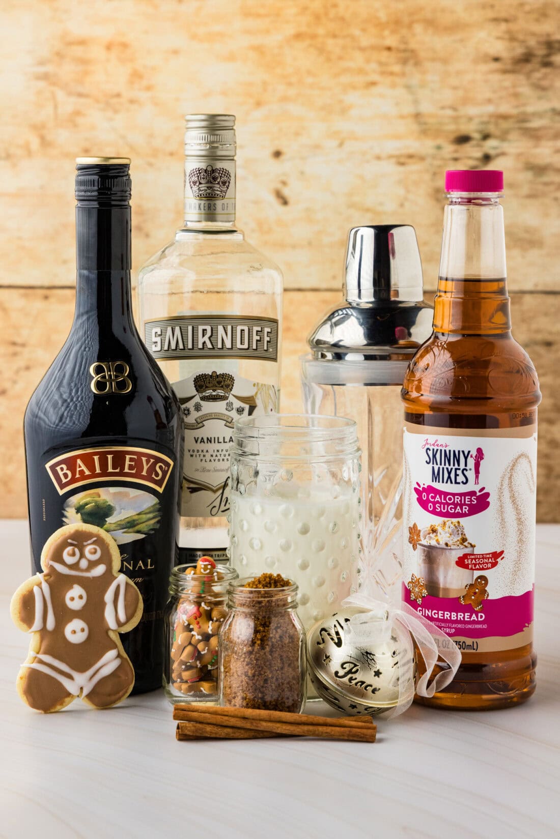 Assorted liquor bottles and holiday-themed ingredients for festive baking and cocktails.
