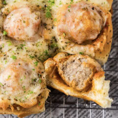 Close up photo of a Meatball Slider with a bite taken out of it