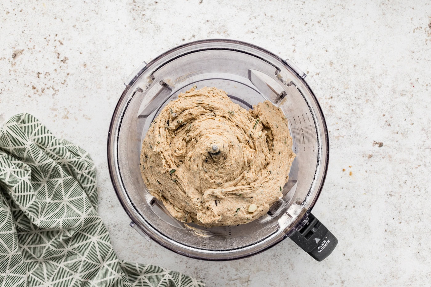 Rosemary garlic bread dough in a food processor