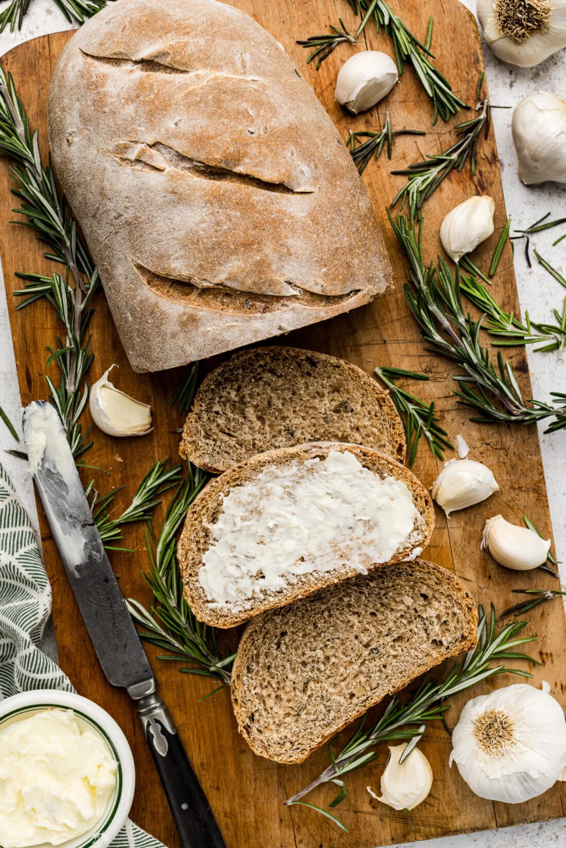 Slices of Rosemary Garlic Bread with on slice buttered
