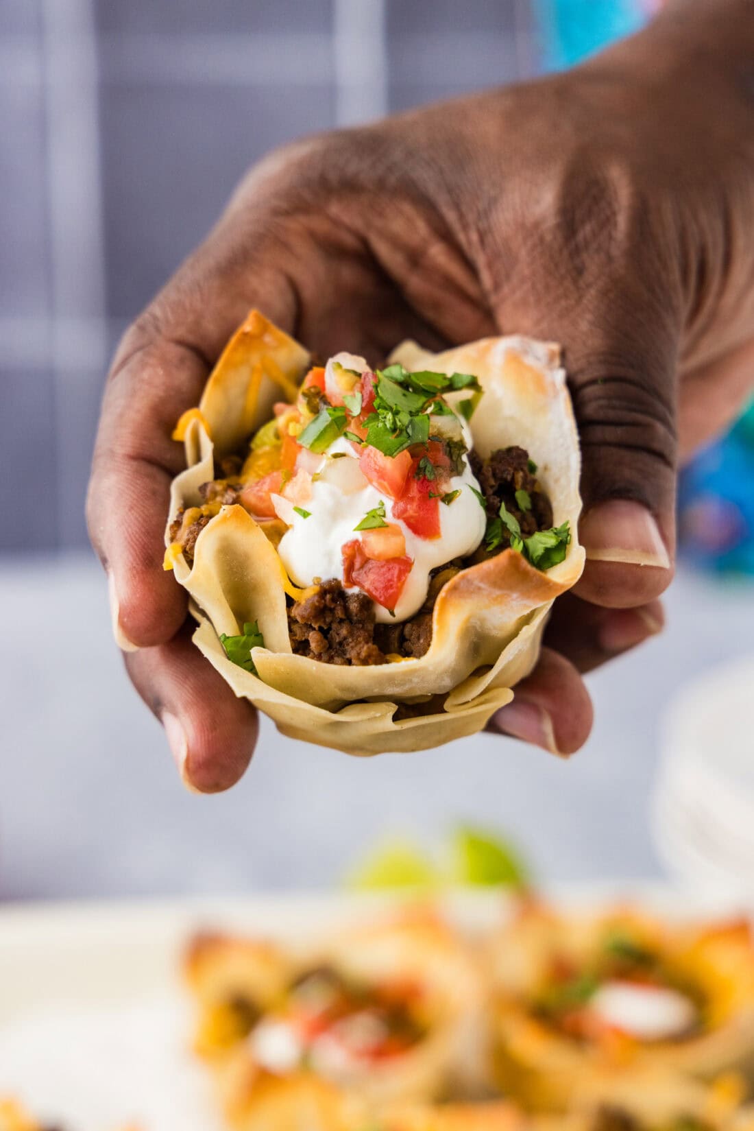 Hand holding a Taco Cup