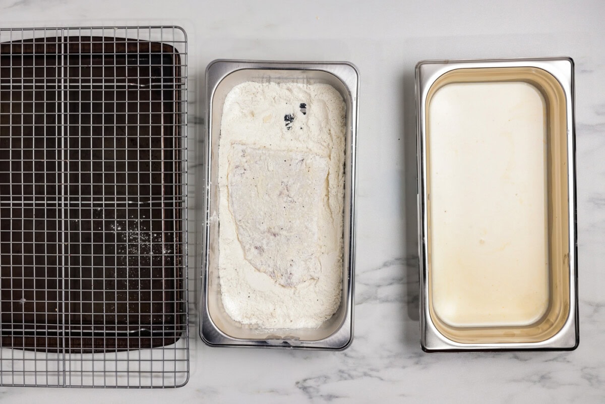Cube steak dredged in a breading tray of flour and seasonings