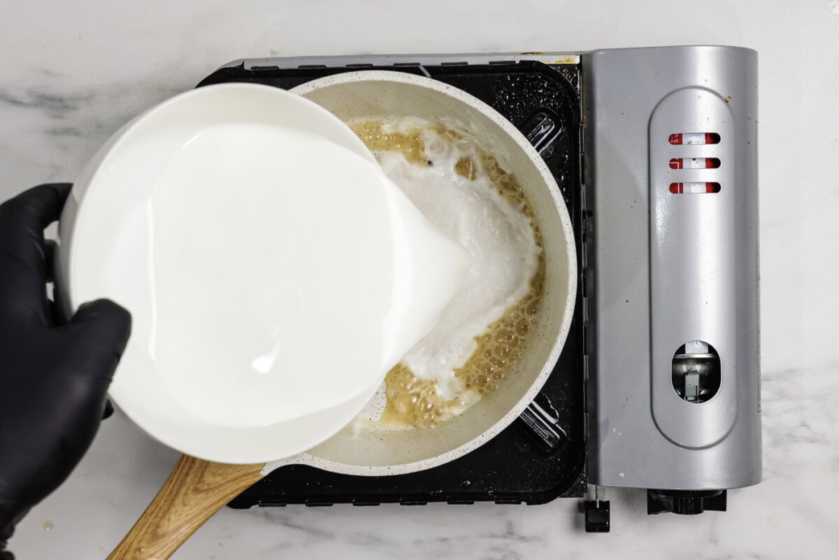 buttermilk poured into a saucepan with oil