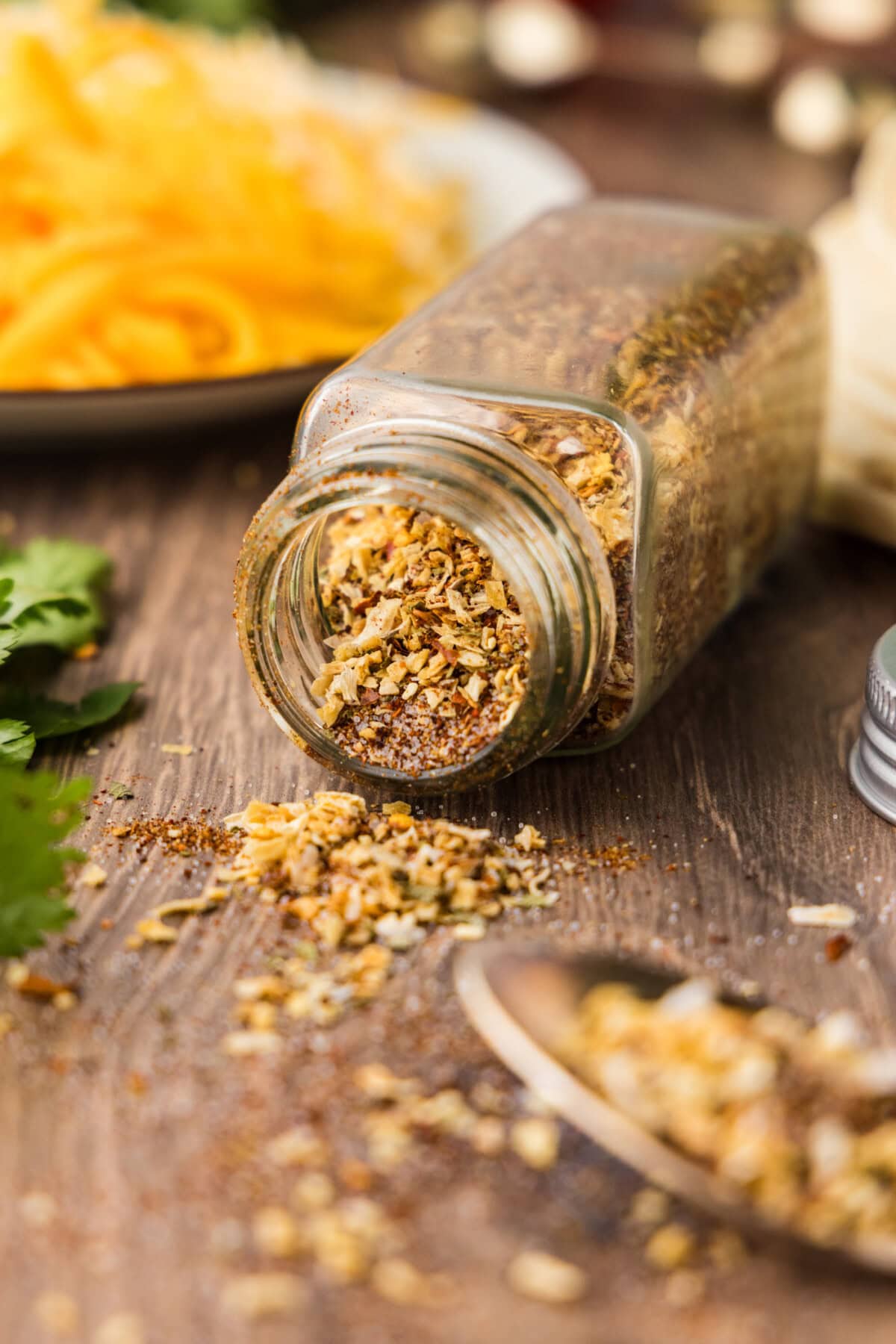 homemade taco seasoning in a jar that fell over and is spilling out