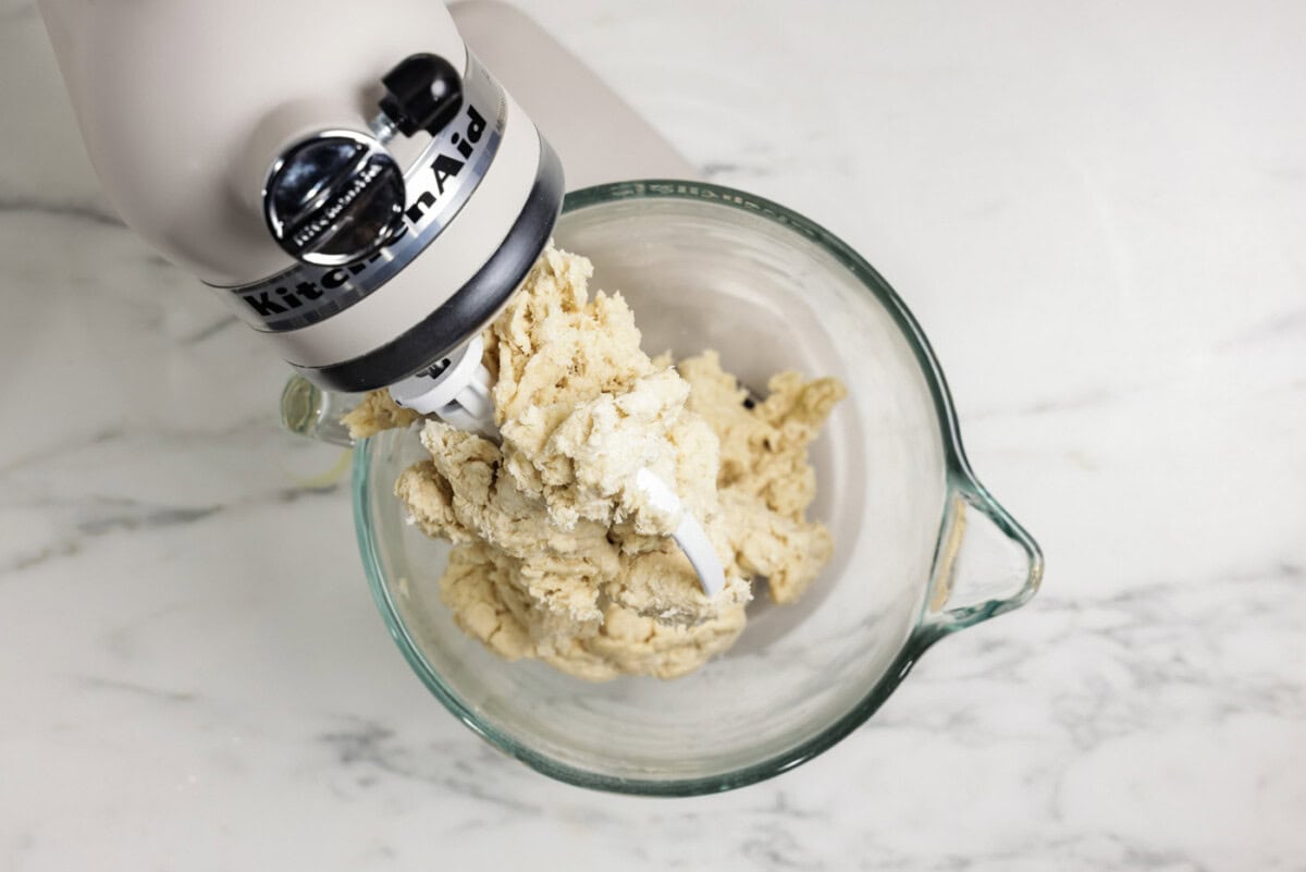 bread dough ingredients in a stand mixer bowl