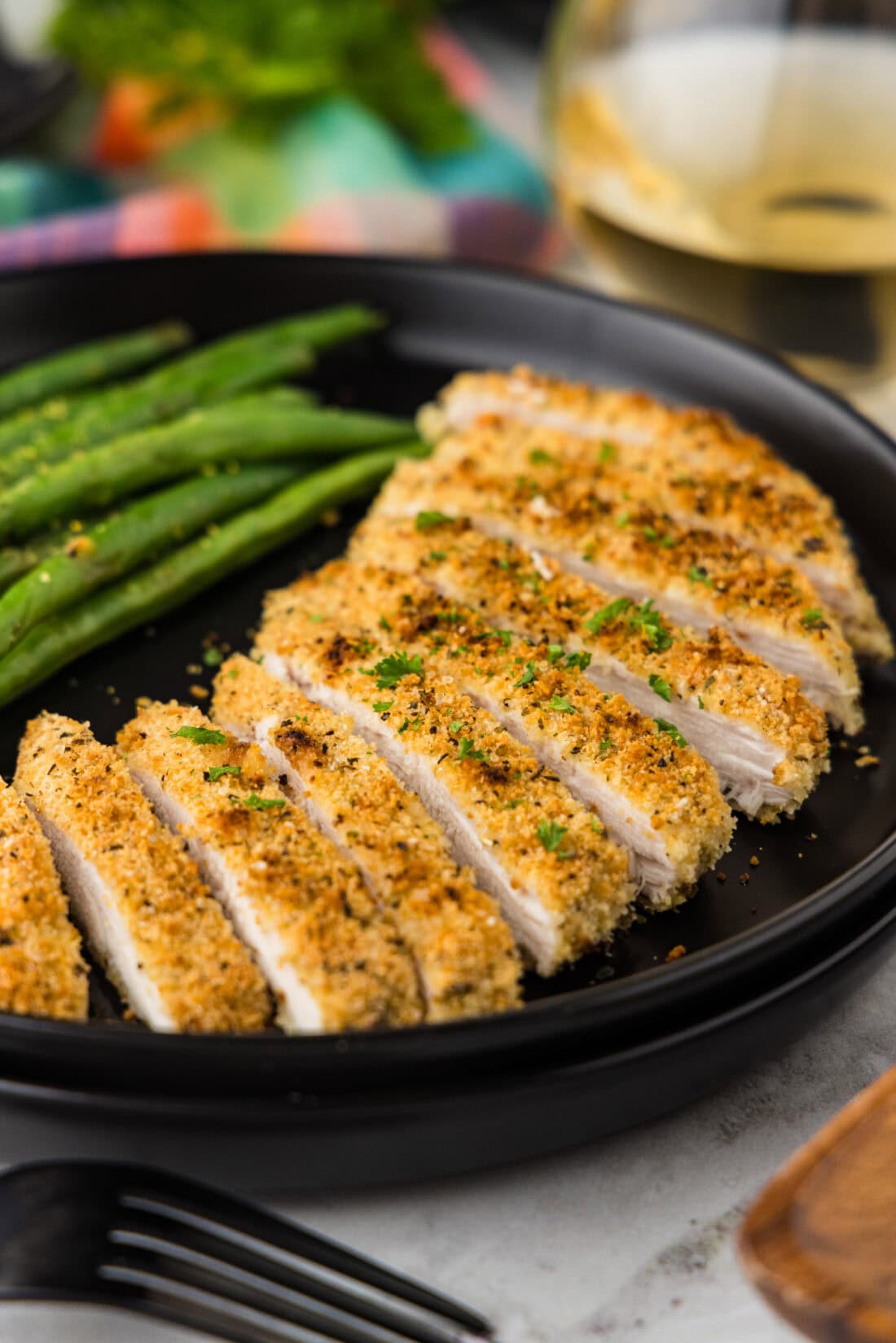 Close up photo of slices of Parmesan Crusted Chicken