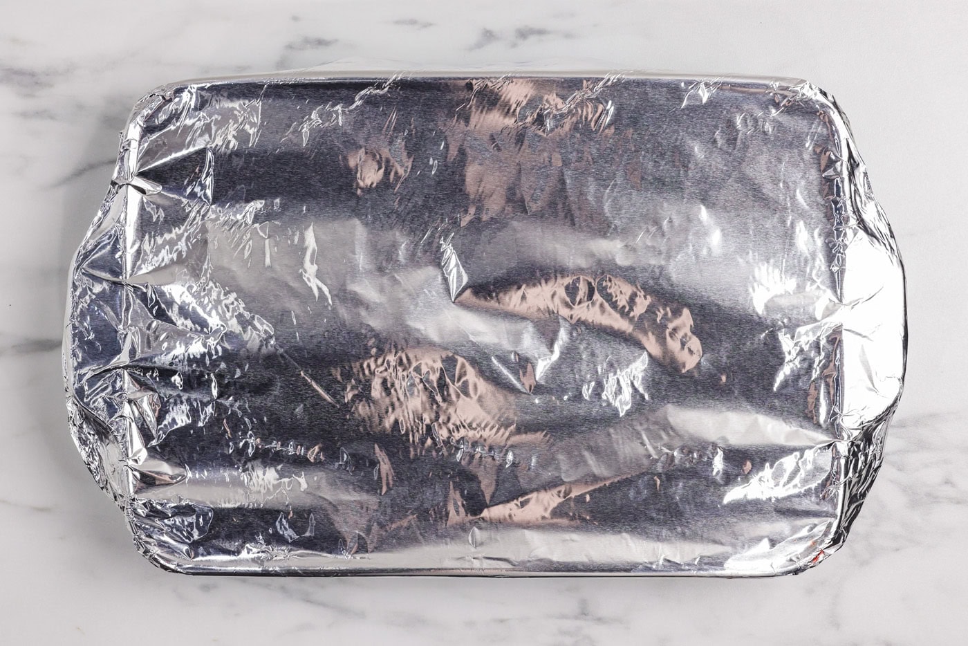Overhead photo of a foil covered dish