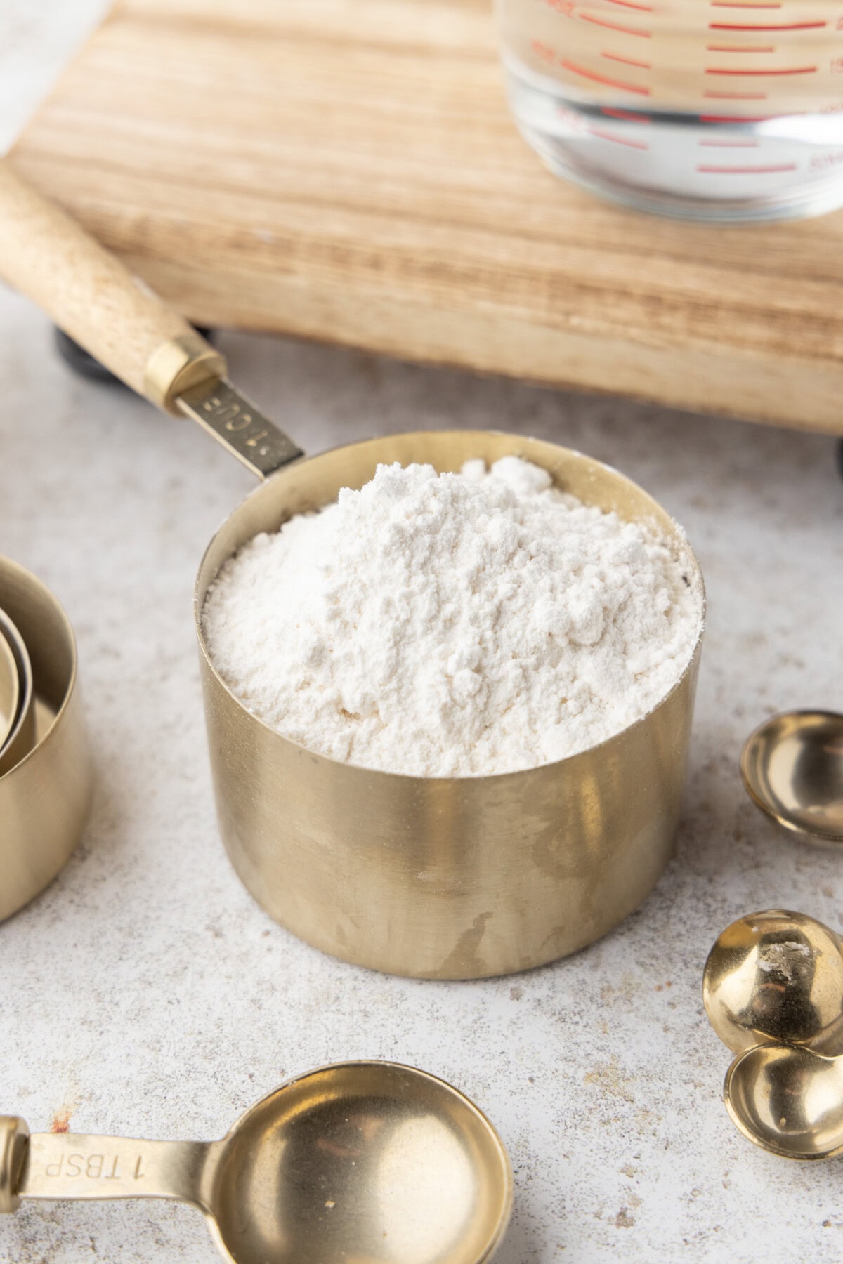 a dry measuring cup with flour