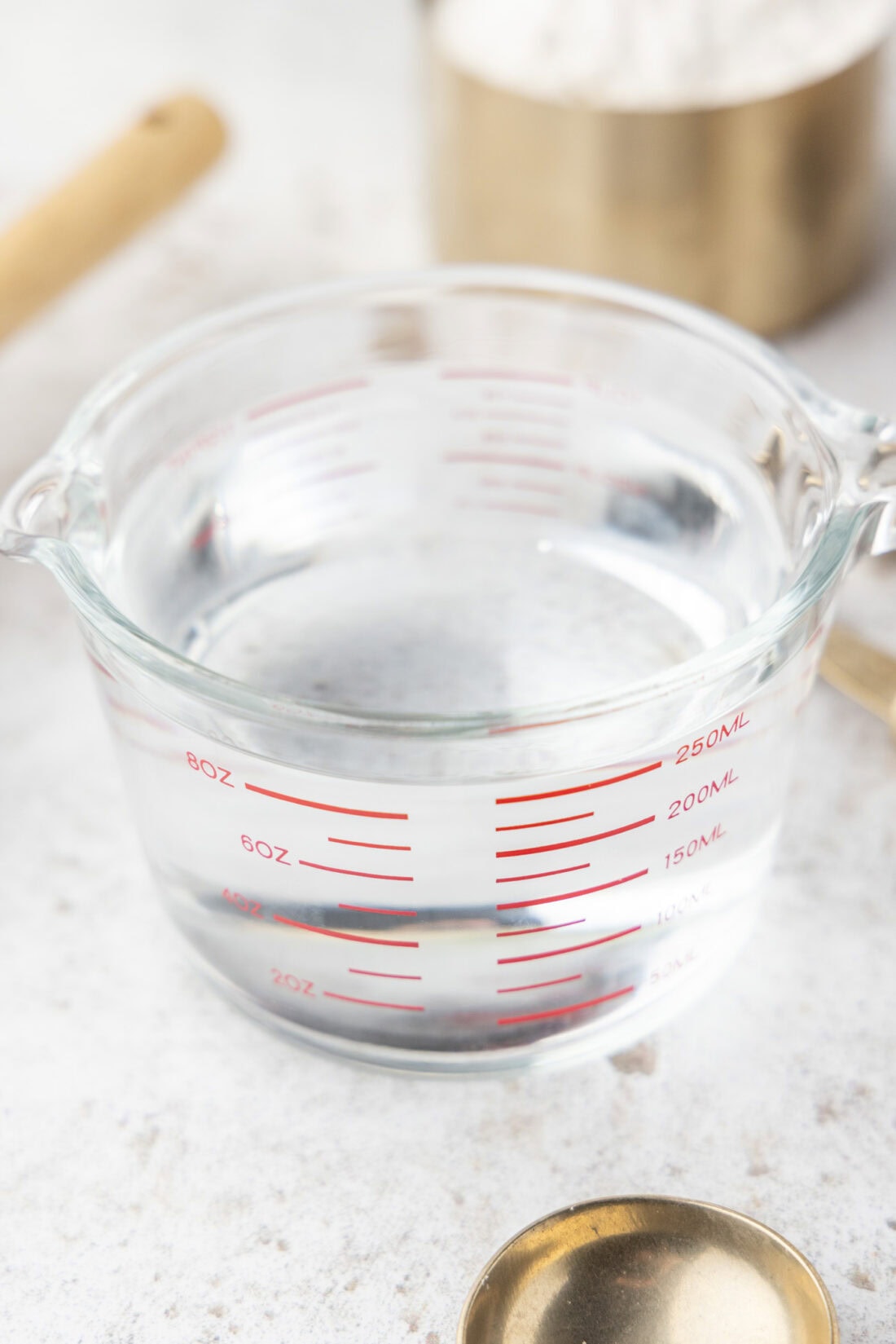 a glass measuring cup with water