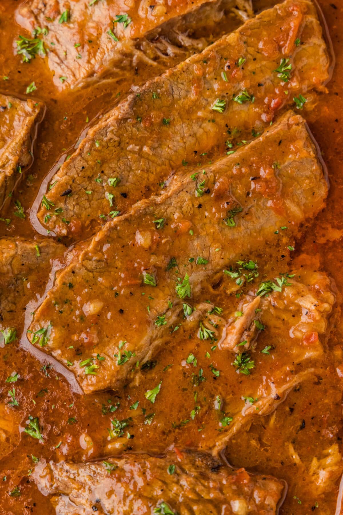 closed of of sliced beef brisket and gravy