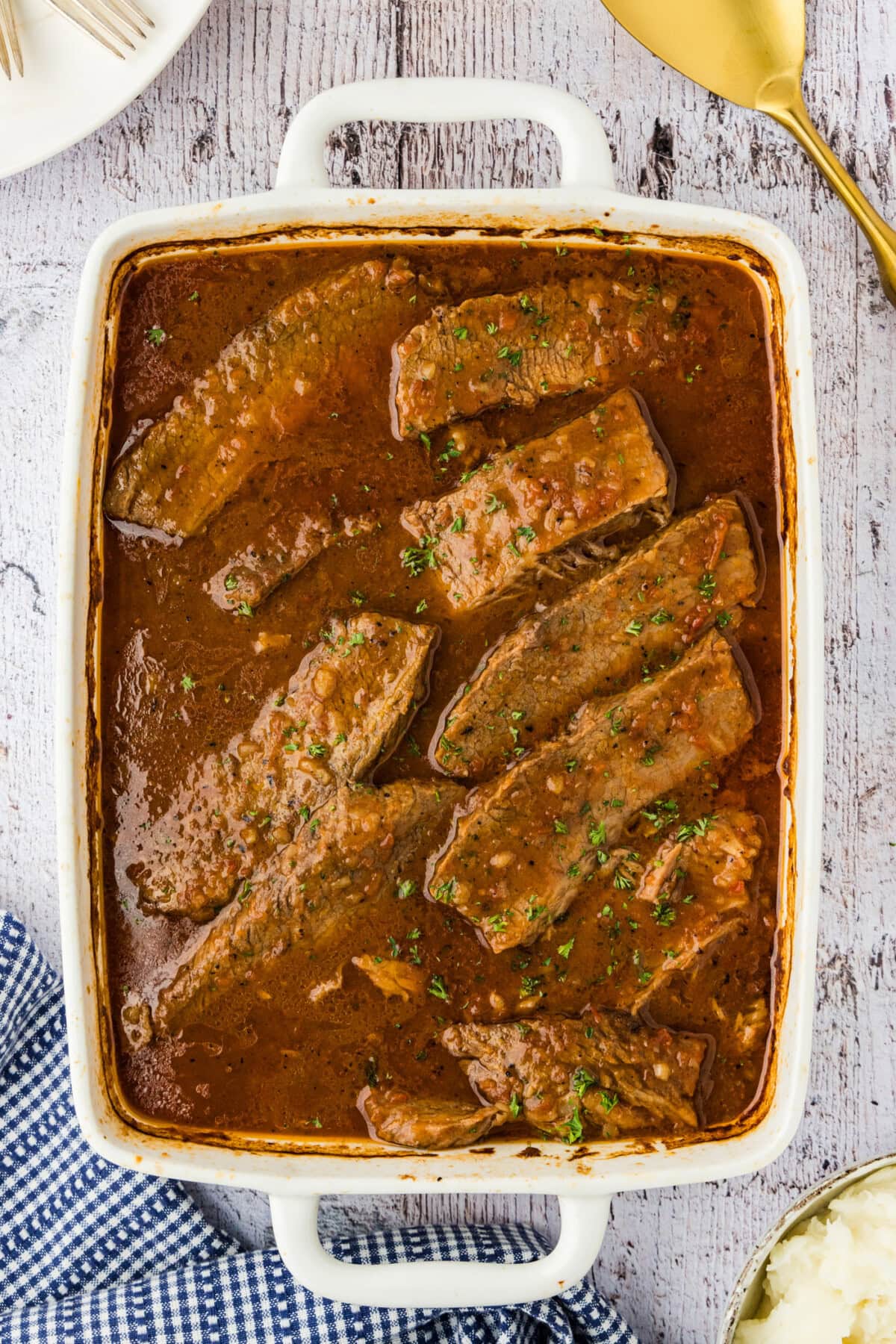 beef brisket and gravy in a 13x9 dish