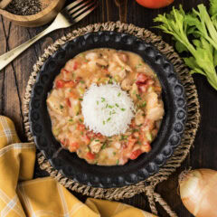 Bowl of Chicken Etouffee with a scoop of rice in the center