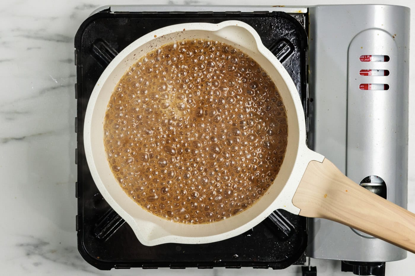 Gravy simmering in a saucepan