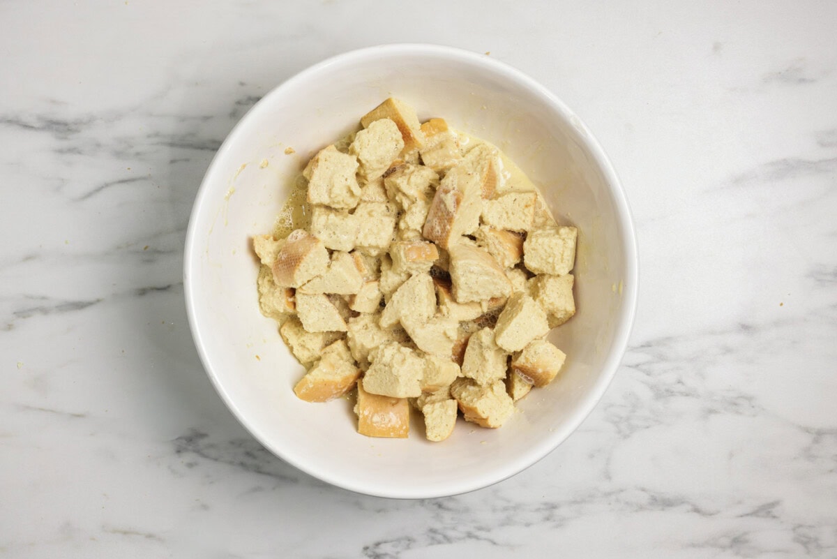 cubed bread in a bowl with custard filling