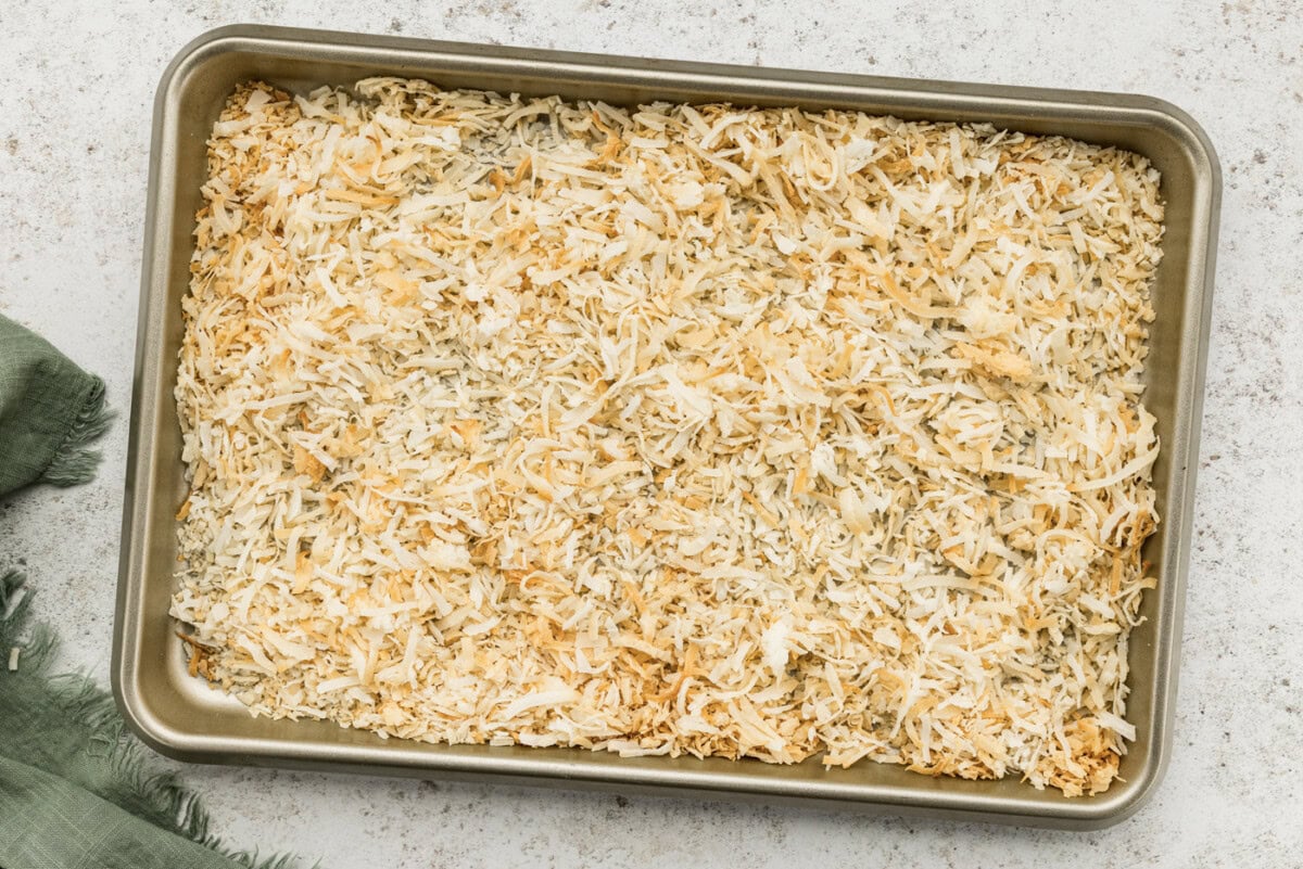 Toasted shredded coconut on a baking sheet
