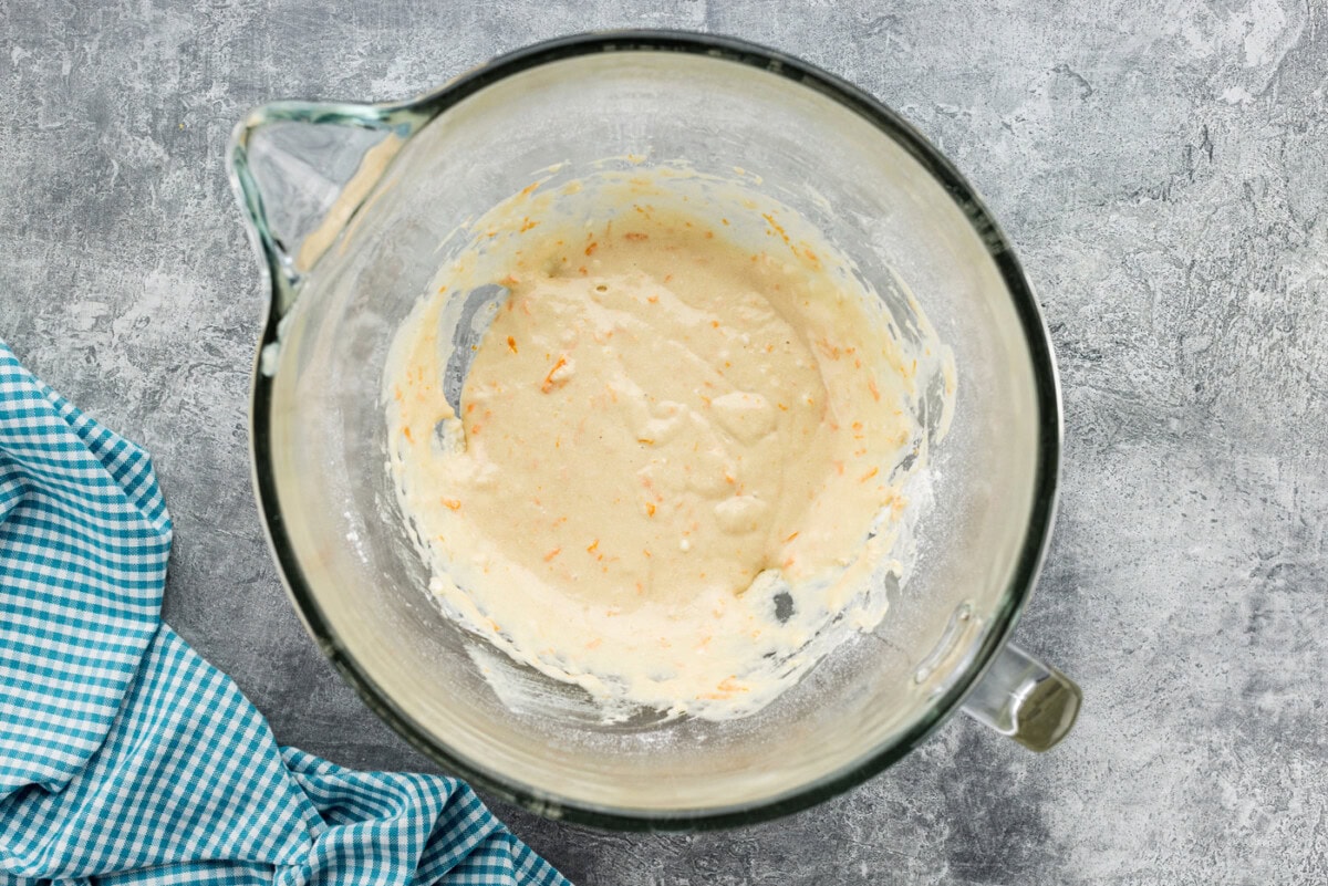 Orange roll batter in a stand mixer bowl