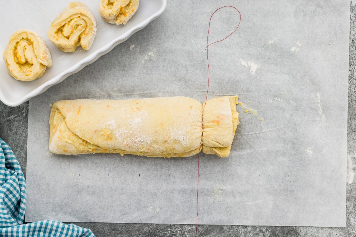 Slicing dough log with string