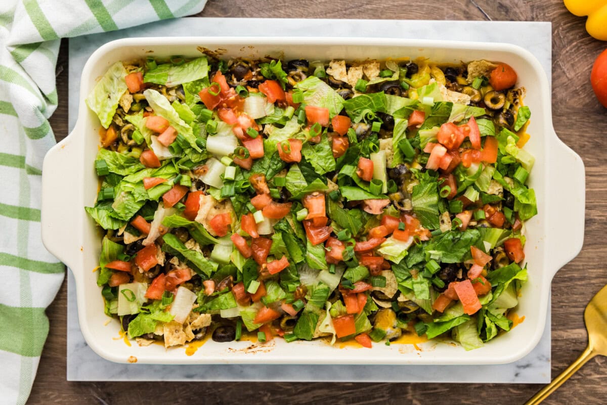 Shredded lettuce and chopped tomatoes added on top of baked taco casserole